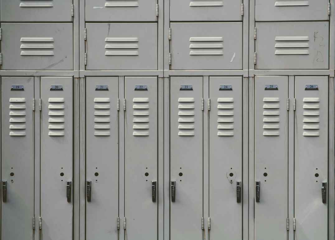 photograph of old, gray school lockers.
